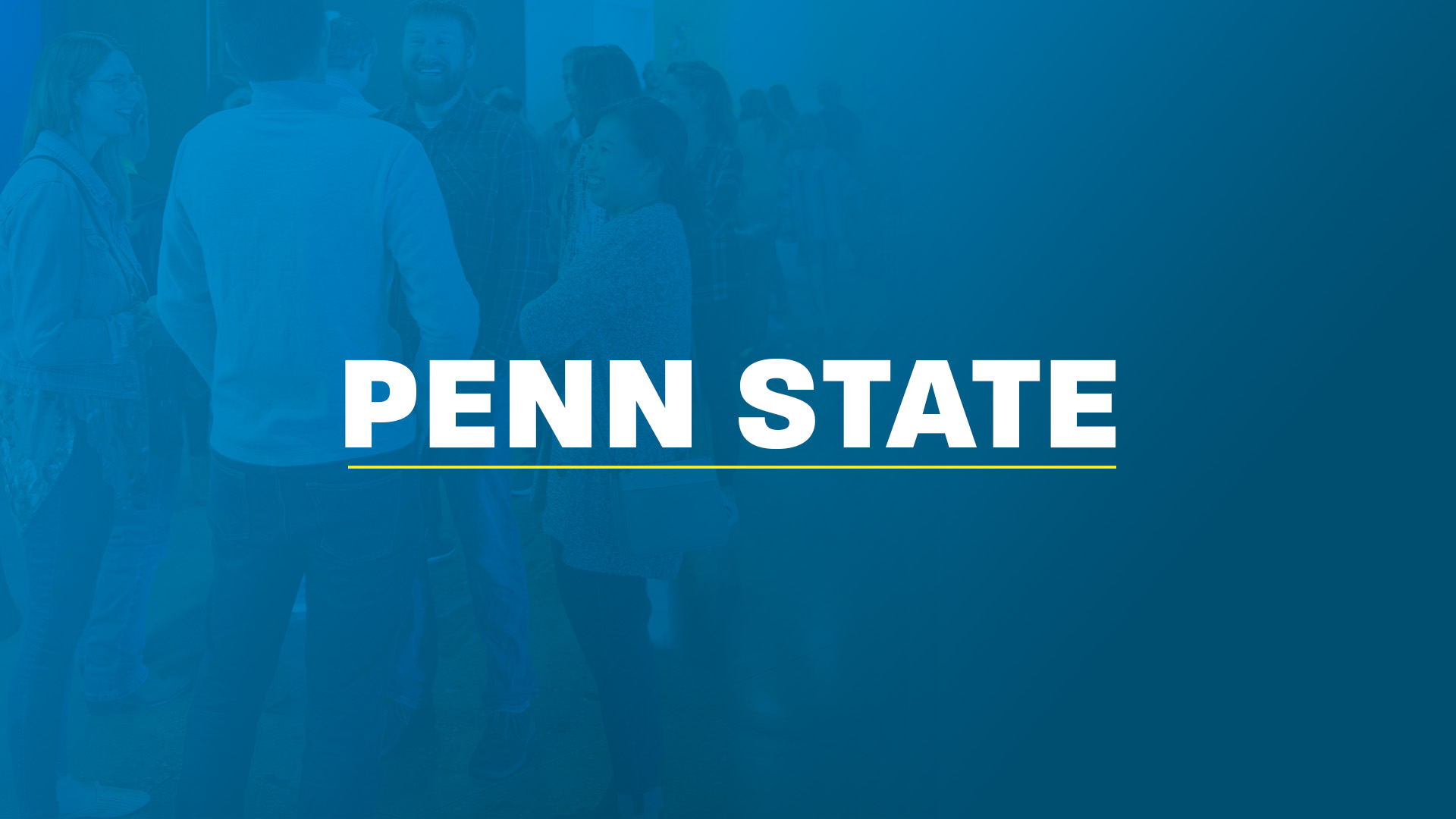 Four young people smiling together in front of the words ‘Penn State,’ written in white and underlined in yellow